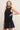 Vestido corto negro con polipel y antelina.